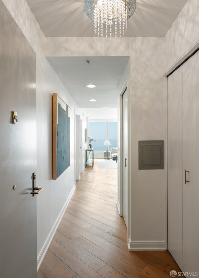 401 Harrison St Unit 25F, San Francisco, CA 94105 - hall featuring hardwood / wood-style floors, baseboards, a chandelier, and recessed lighting