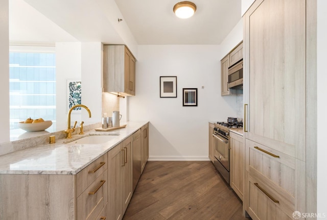 401 Harrison St Unit 25F, San Francisco, CA 94105 - kitchen featuring stainless steel appliances, a sink, dark wood-style flooring, baseboards, and light brown cabinets