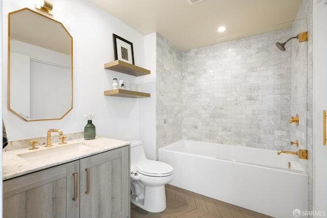 401 Harrison St Unit 25F, San Francisco, CA 94105 - bathroom featuring toilet, vanity, bathing tub / shower combination, and tile patterned floors