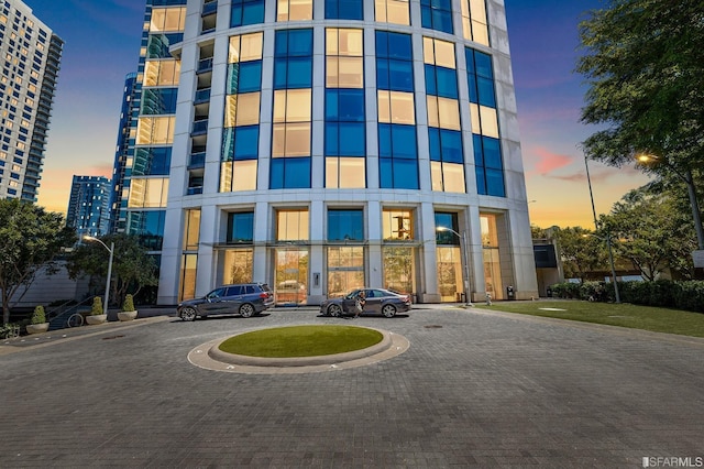 view of outdoor building at dusk