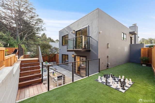 rear view of property featuring a yard and a patio