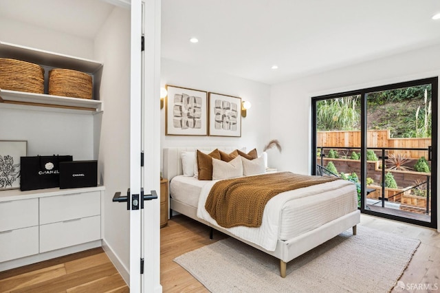 bedroom featuring access to outside and light wood-type flooring