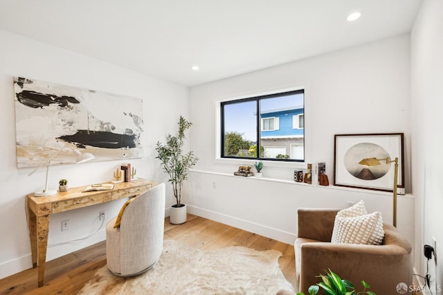 sitting room with hardwood / wood-style floors