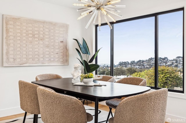 dining space featuring a notable chandelier and a wealth of natural light