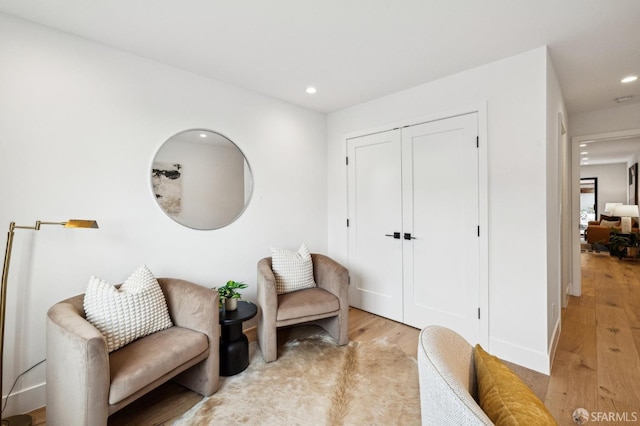 living area with light hardwood / wood-style floors