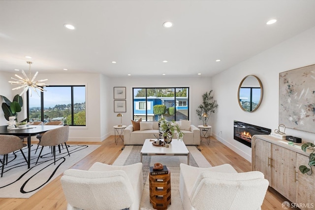 living room featuring a healthy amount of sunlight and light wood-type flooring