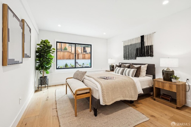 bedroom with light hardwood / wood-style floors