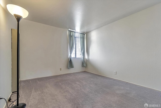 unfurnished room with carpet flooring