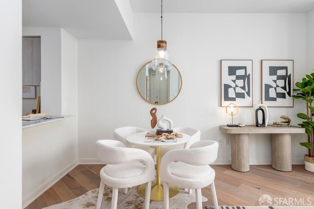 dining area with light hardwood / wood-style flooring