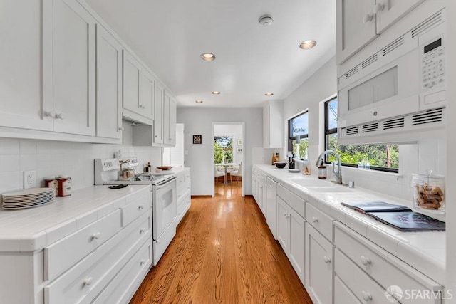 35 Ardilla Rd, Orinda, CA 94563 - kitchen featuring white appliances, tile countertops, tasteful backsplash, recessed lighting, and white cabinets
