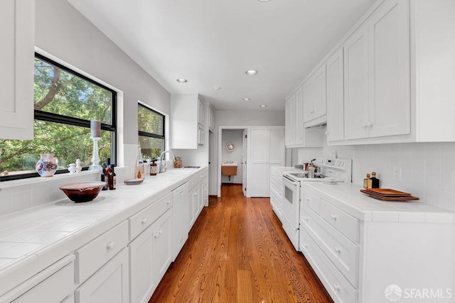 35 Ardilla Rd, Orinda, CA 94563 - kitchen featuring white appliances, tile counters, white cabinetry, decorative backsplash, and recessed lighting