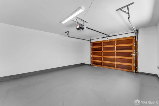 35 Ardilla Rd, Orinda, CA 94563 - garage featuring a garage door opener and baseboards