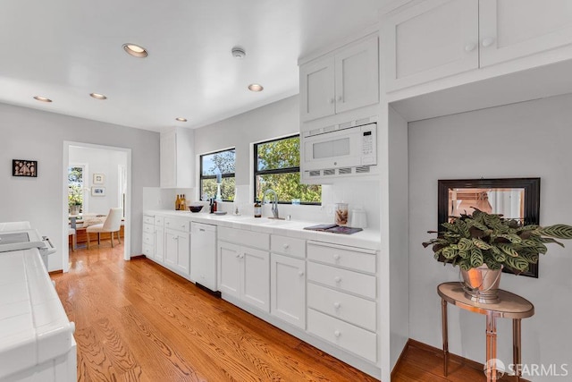 35 Ardilla Rd, Orinda, CA 94563 - kitchen featuring white appliances, tile counters, recessed lighting, white cabinetry, and light wood-style floors