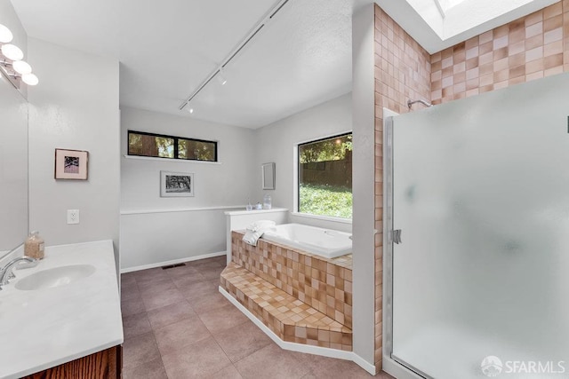 35 Ardilla Rd, Orinda, CA 94563 - full bathroom featuring vanity, a stall shower, a bath, and healthy amount of natural light