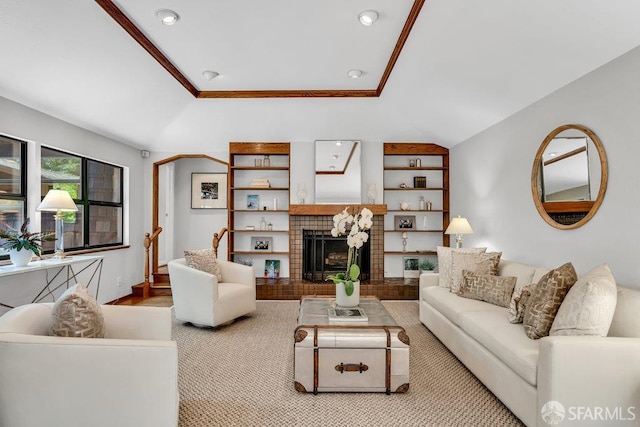 35 Ardilla Rd, Orinda, CA 94563 - living room featuring a tray ceiling, recessed lighting, a fireplace with raised hearth, light wood finished floors, and built in features