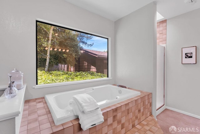 35 Ardilla Rd, Orinda, CA 94563 - bathroom with tiled tub and tile patterned floors