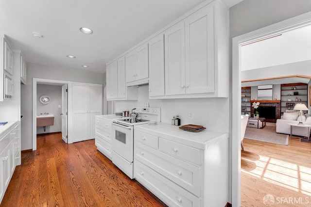 35 Ardilla Rd, Orinda, CA 94563 - kitchen featuring white appliances, tile counters, wood finished floors, white cabinets, and recessed lighting