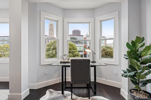 dining space with dark wood-type flooring