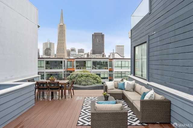 wooden terrace featuring an outdoor hangout area