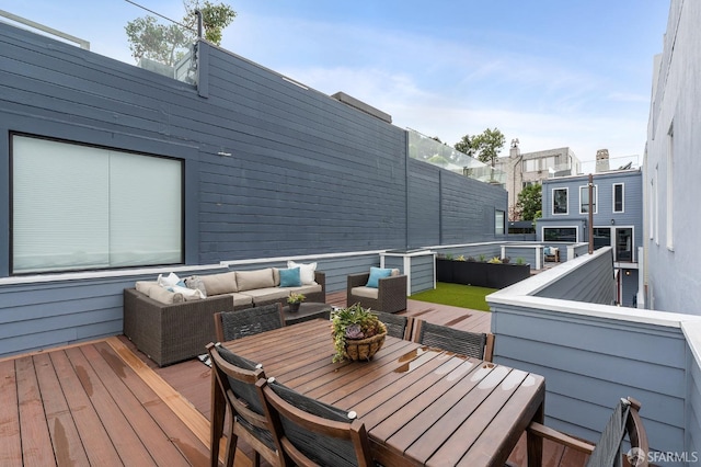 wooden terrace featuring outdoor lounge area