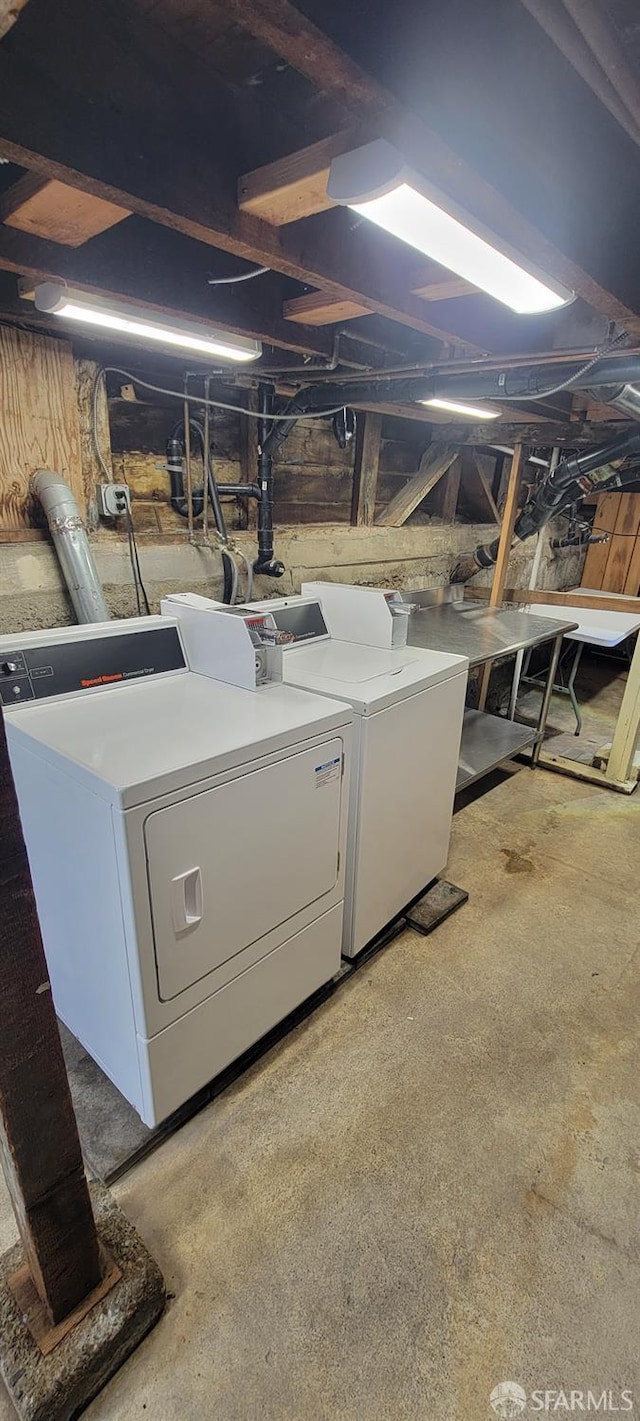 laundry room featuring washing machine and dryer and laundry area