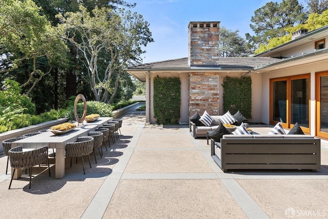 view of patio featuring outdoor lounge area and outdoor dining area