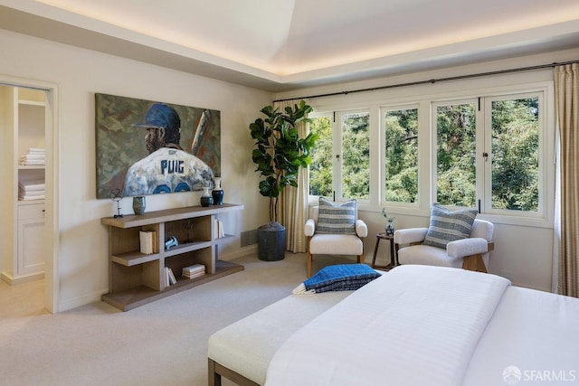 bedroom featuring baseboards, multiple windows, and carpet floors
