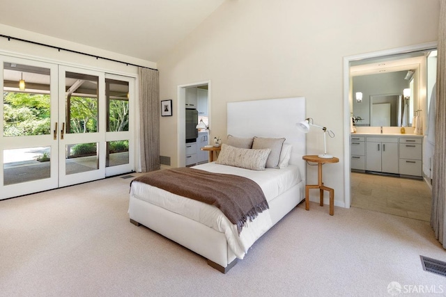 bedroom with visible vents, light carpet, access to exterior, a sink, and french doors