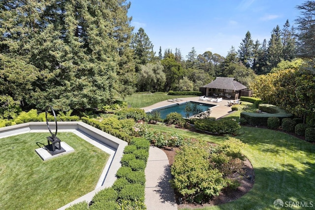 outdoor pool with a gazebo and a yard