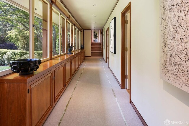 hall featuring baseboards