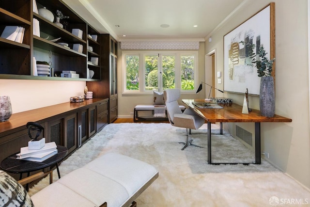 office area with crown molding and baseboards
