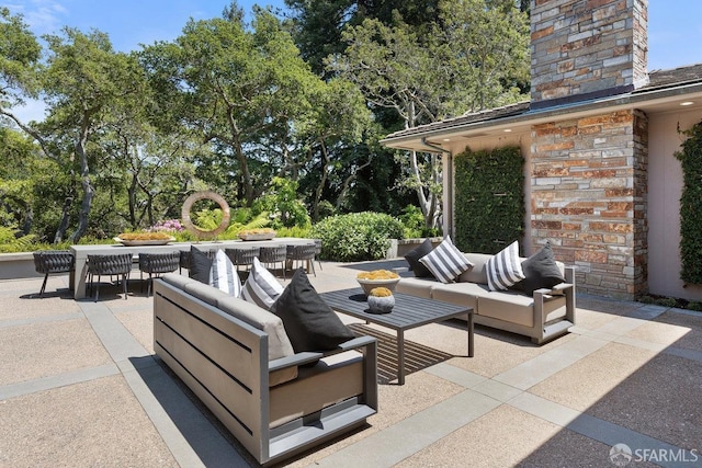 view of patio featuring outdoor lounge area and outdoor dining space