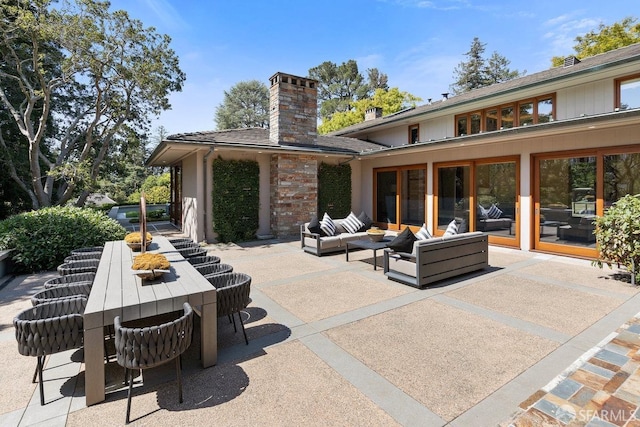 view of patio / terrace featuring an outdoor living space and outdoor dining area