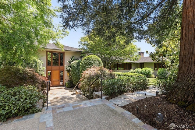 obstructed view of property featuring stucco siding