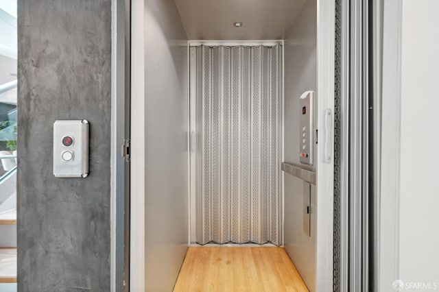 bathroom with hardwood / wood-style floors