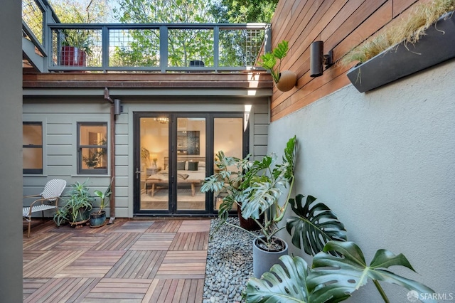 property entrance featuring french doors and a balcony