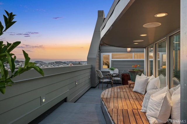 view of balcony at dusk