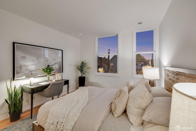 bedroom with hardwood / wood-style floors