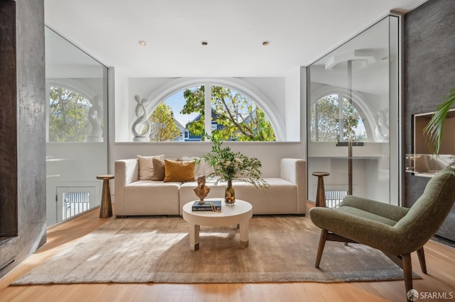 sitting room featuring wood-type flooring