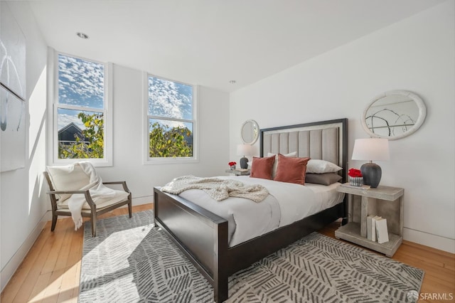 bedroom with light hardwood / wood-style floors