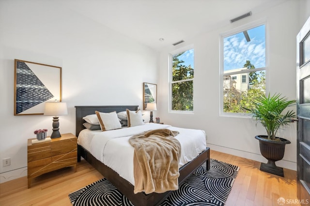 bedroom with hardwood / wood-style flooring