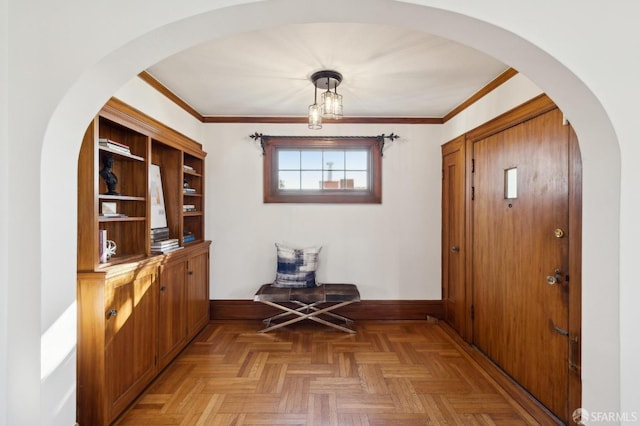 interior space with crown molding and parquet floors