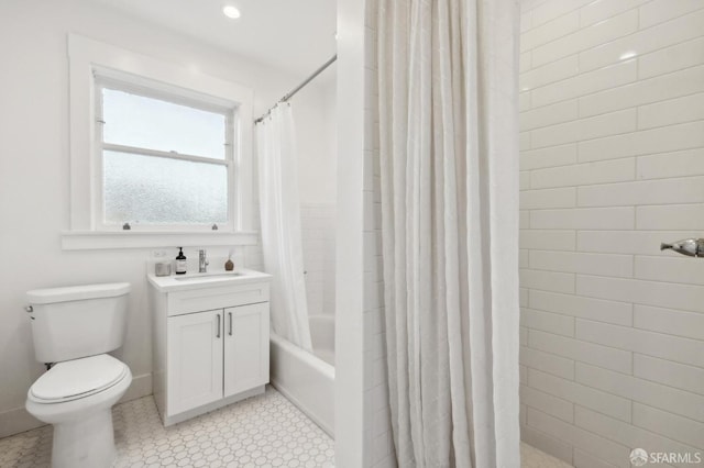 full bathroom featuring toilet, vanity, and shower / bath combo with shower curtain