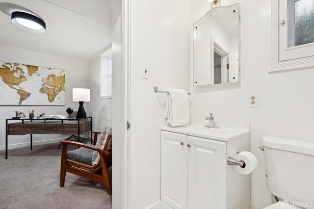 bathroom featuring toilet and vanity