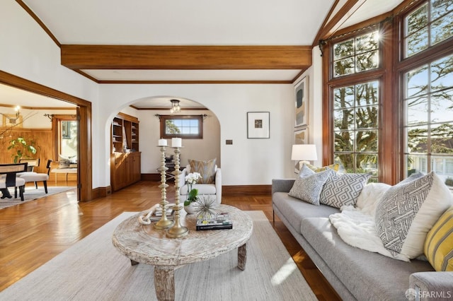 living room with beam ceiling and light parquet flooring