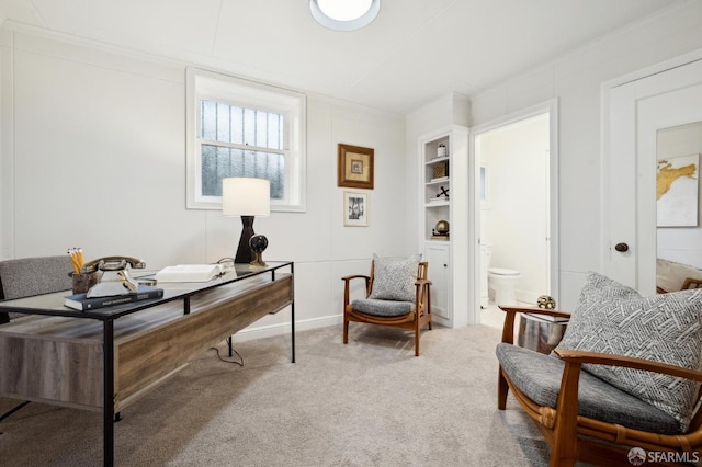 home office featuring carpet flooring, built in features, and ornamental molding