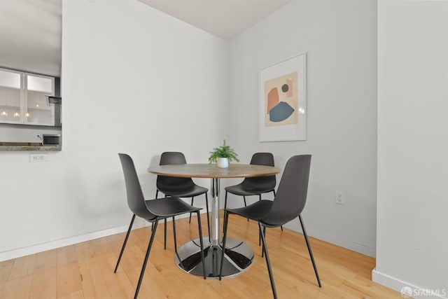 dining area with light hardwood / wood-style flooring