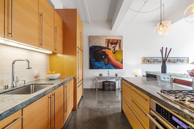 kitchen with sink, dark stone countertops, hanging light fixtures, decorative backsplash, and oven