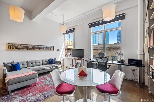 dining room featuring beamed ceiling