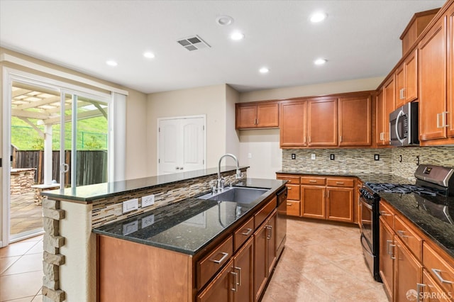 3642 Mallard Way, Antioch, CA 94509 - kitchen featuring a sink, dark stone counters, visible vents, brown cabinets, and appliances with stainless steel finishes
